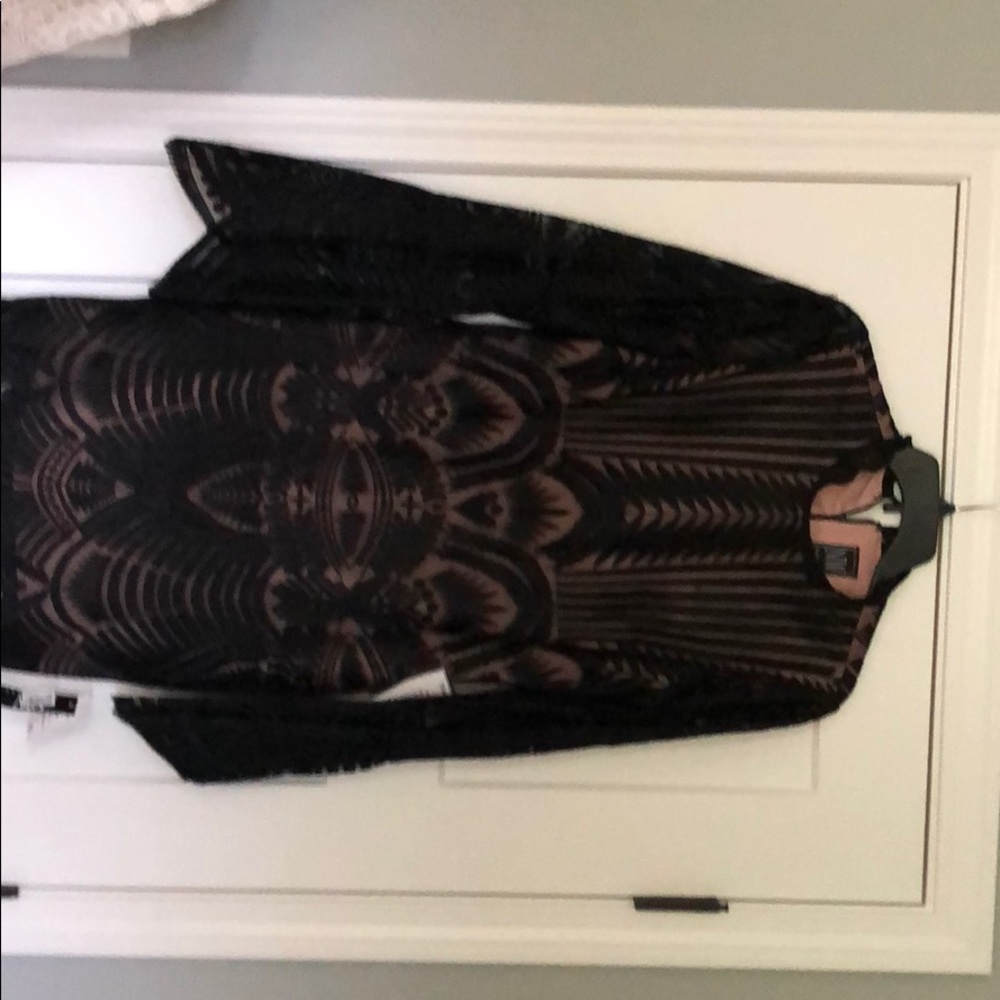 Black overlay lace type dress. Bell sleeves.